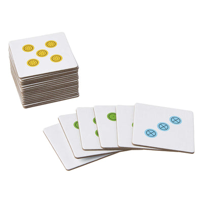 Stacked Cardboard tiles from Peek and Push game next to tiles fanned out 